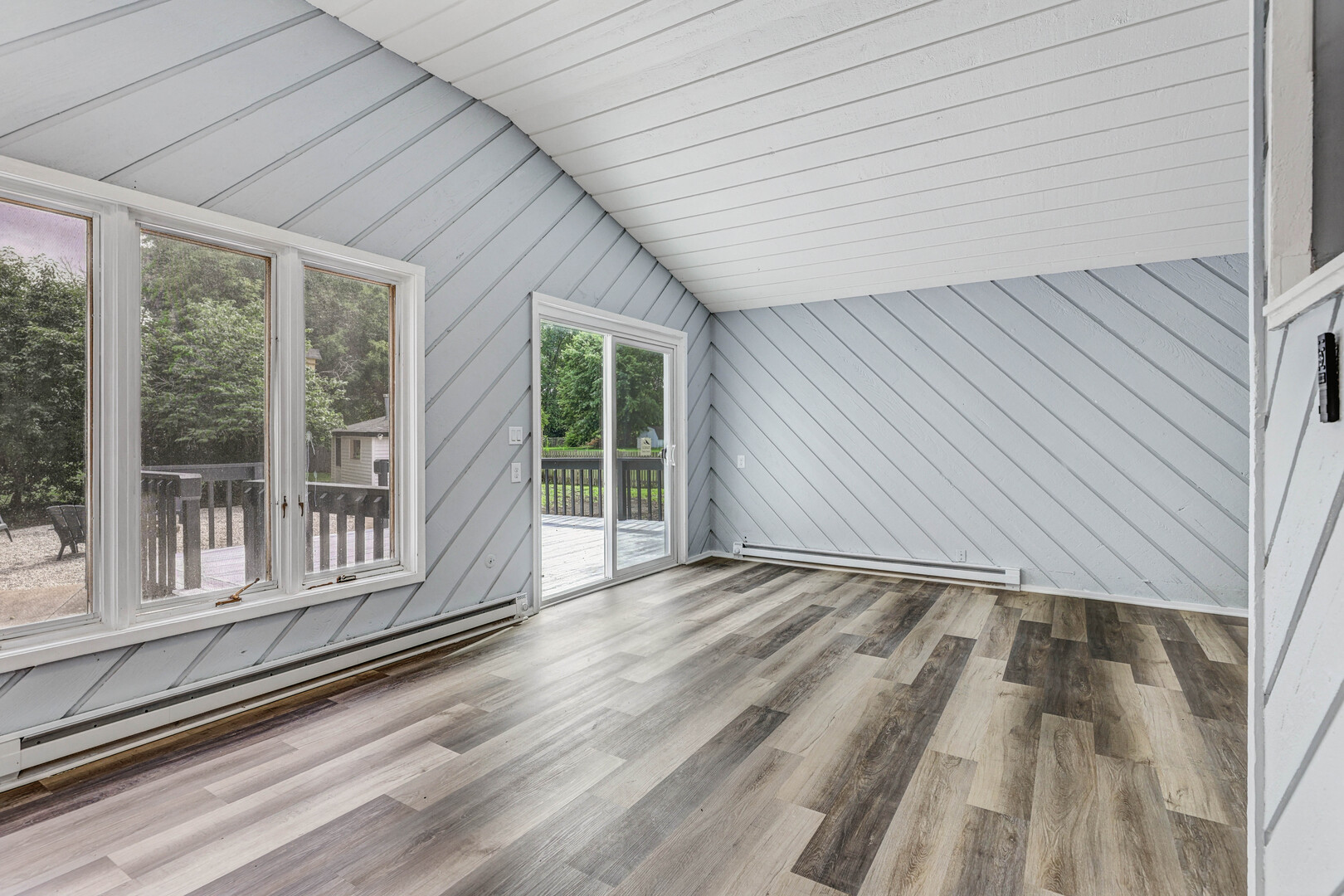 7001 Meadow Lane Road Long Grove, IL 60060 - Photo 7 of 48 a view of an empty room with wooden floor and a window