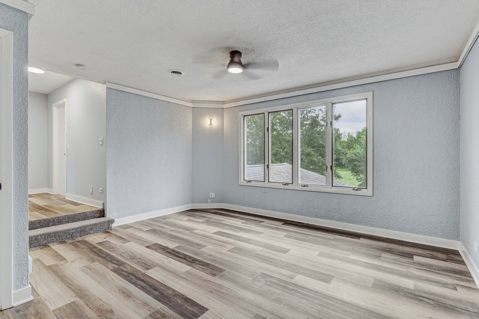 7001 Meadow Lane Road Long Grove, IL 60060 - Photo 9 of 48 a view of empty room with wooden floor and fan