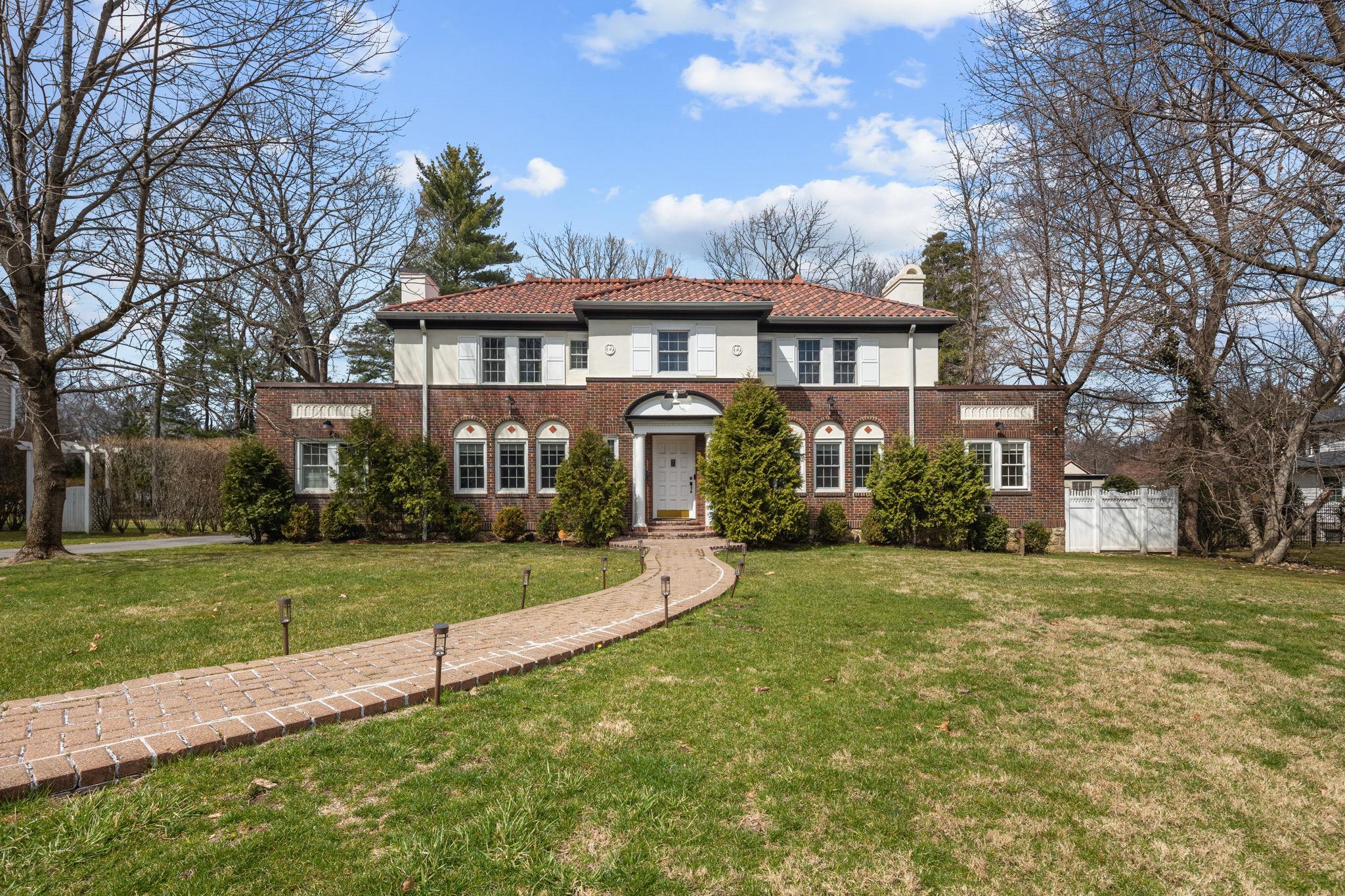 182 Lyncroft Road New Rochelle, NY 10804 - Photo 1 of 1 View of front of home with a chimney, a front yard, and brick siding