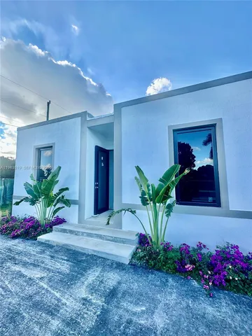 a view of a entryway with flower pots