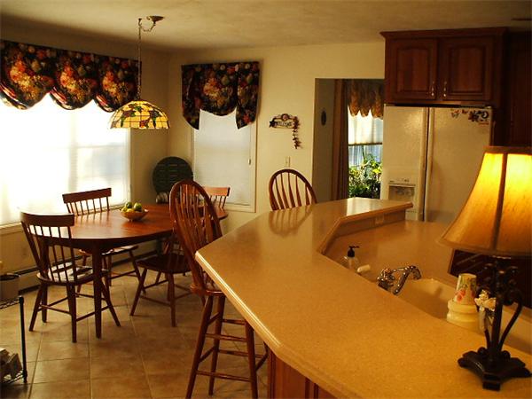175 Ellis Road Westminster, MA 01473 - Photo 4 of 14 a view of a dining room with furniture and a window