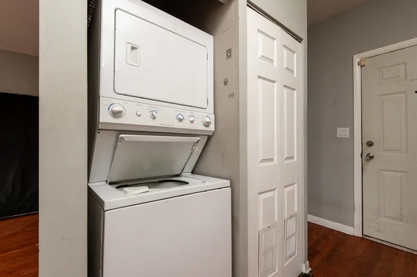 a view of washer and dryer with wooden floor