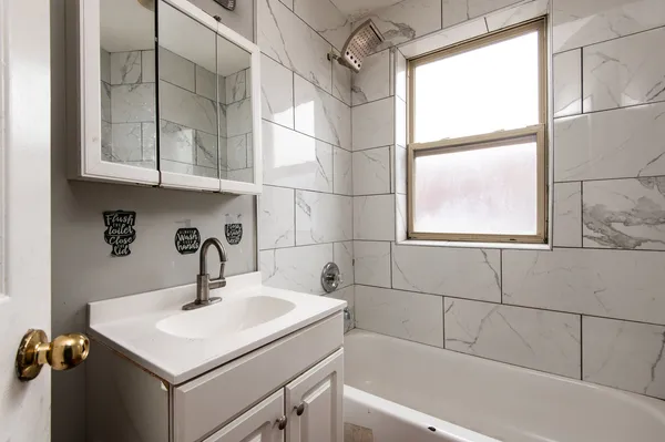 a bathroom with a sink and a bathtub