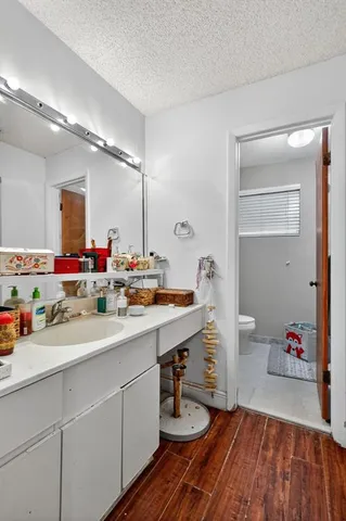 a bathroom with a sink double vanity granite and a mirror