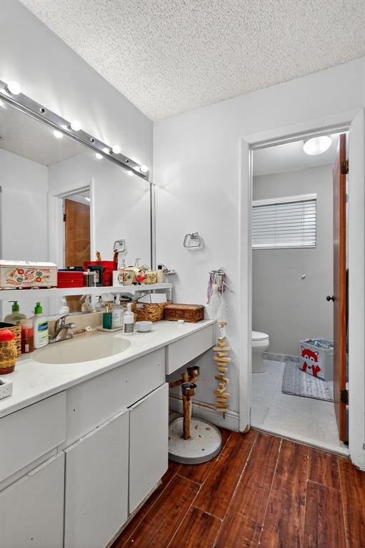 13501 Southwest 62nd Street, Unit 1 Miami, FL 33183 - Photo 15 of 38 a bathroom with a sink double vanity granite and a mirror