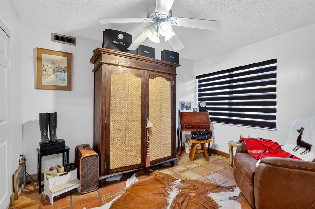 13501 Southwest 62nd Street, Unit 1 Miami, FL 33183 - Photo 22 of 38 a view of a livingroom with workspace and a window