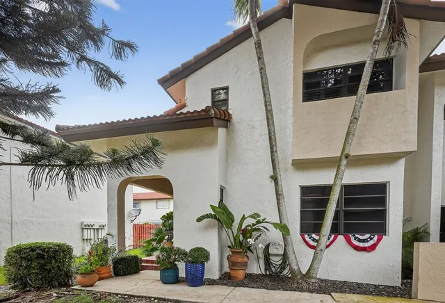an aerial view of residential houses with outdoor space and street view