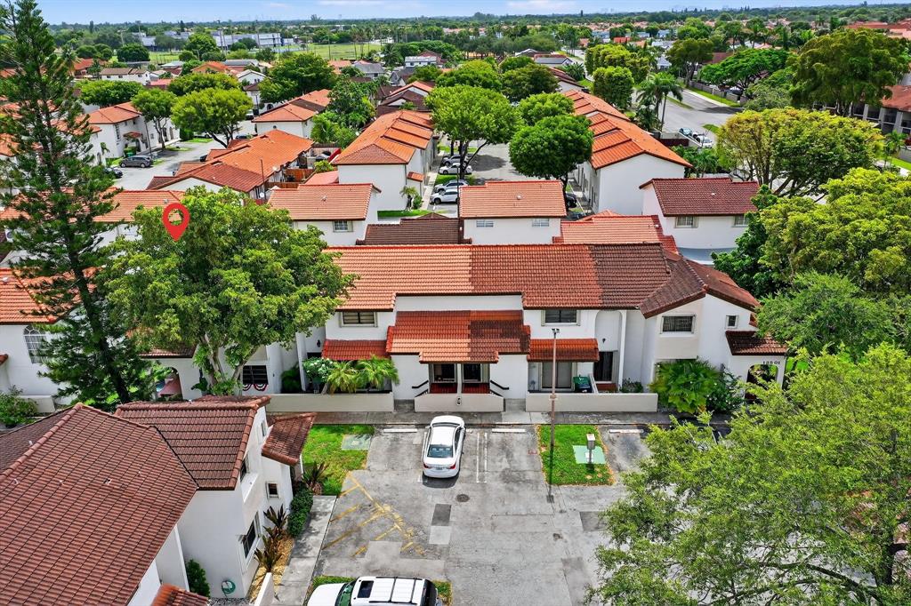 13501 Southwest 62nd Street, Unit 1 Miami, FL 33183 - Photo 29 of 38 an aerial view of a house with garden space and street view