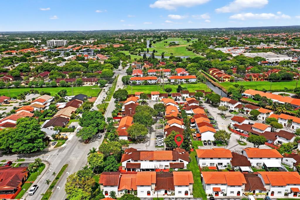 13501 Southwest 62nd Street, Unit 1 Miami, FL 33183 - Photo 35 of 38 an aerial view of residential building and car parked