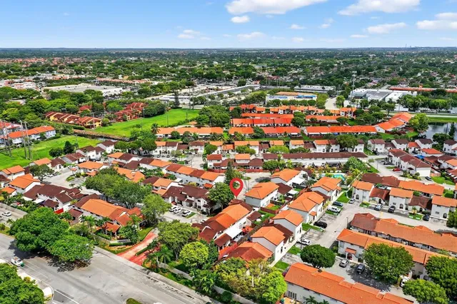 an aerial view of residential houses with outdoor space