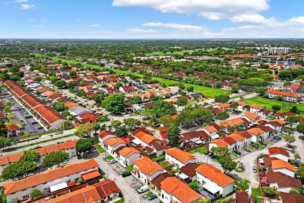 13501 Southwest 62nd Street, Unit 1 Miami, FL 33183 - Photo 37 of 38 an aerial view of residential houses with outdoor space