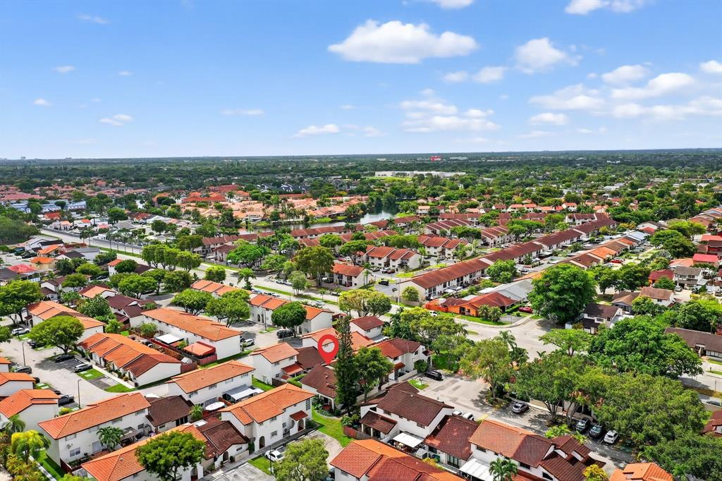 13501 Southwest 62nd Street, Unit 1 Miami, FL 33183 - Photo 38 of 38 an aerial view of residential houses with outdoor space and trees