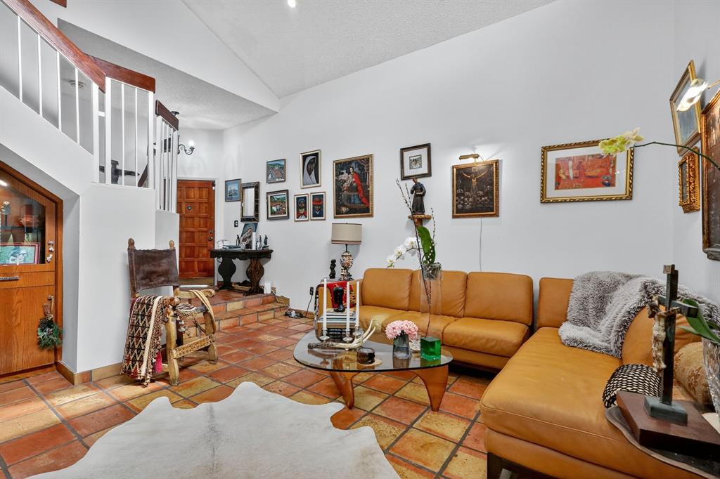 13501 Southwest 62nd Street, Unit 1 Miami, FL 33183 - Photo 4 of 38 a living room with furniture a couch and paintings on the wall