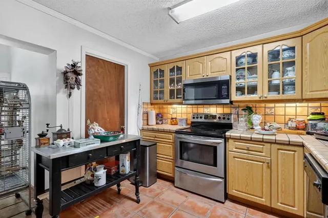 a kitchen with a stove and a sink