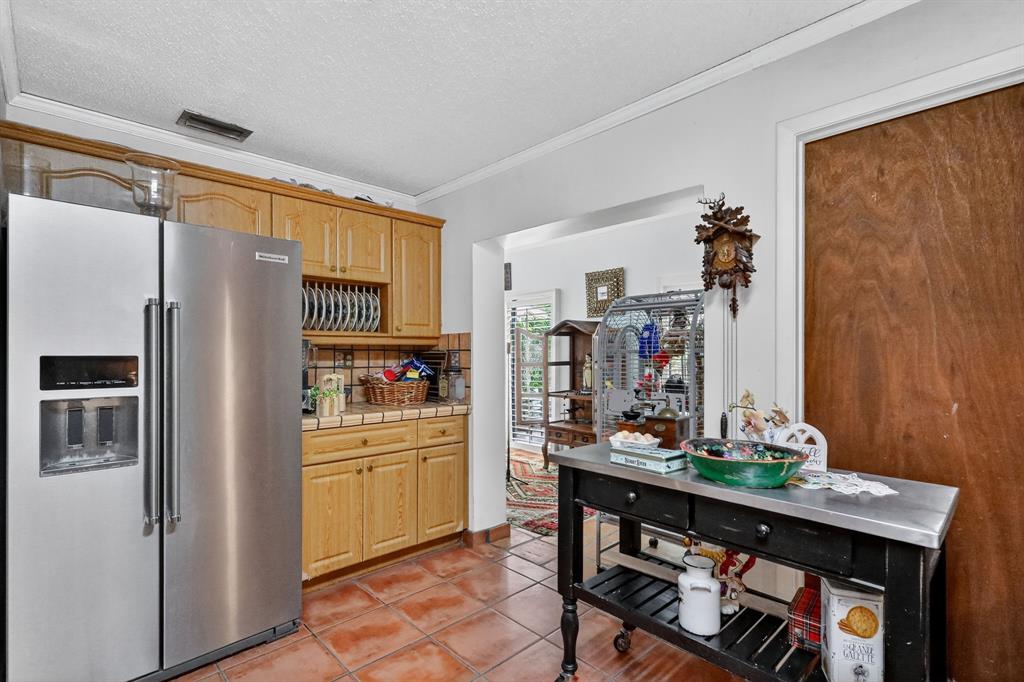 13501 Southwest 62nd Street, Unit 1 Miami, FL 33183 - Photo 7 of 38 a kitchen with stainless steel appliances a refrigerator and a stove