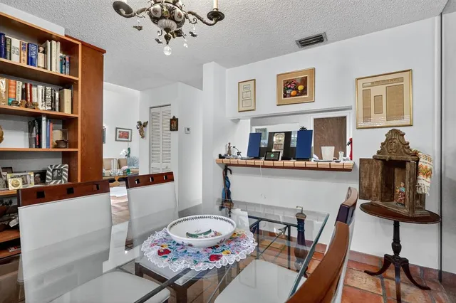 a living room with fireplace furniture and a book shelf