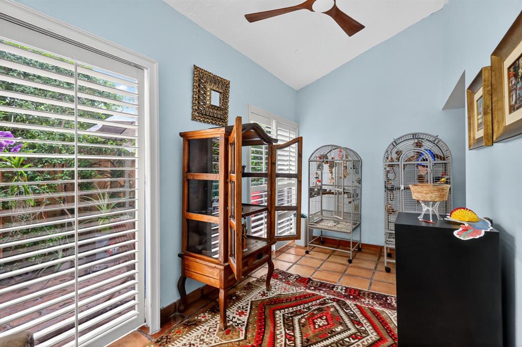 13501 Southwest 62nd Street, Unit 1 Miami, FL 33183 - Photo 10 of 38 a bedroom with a bed and a chandelier