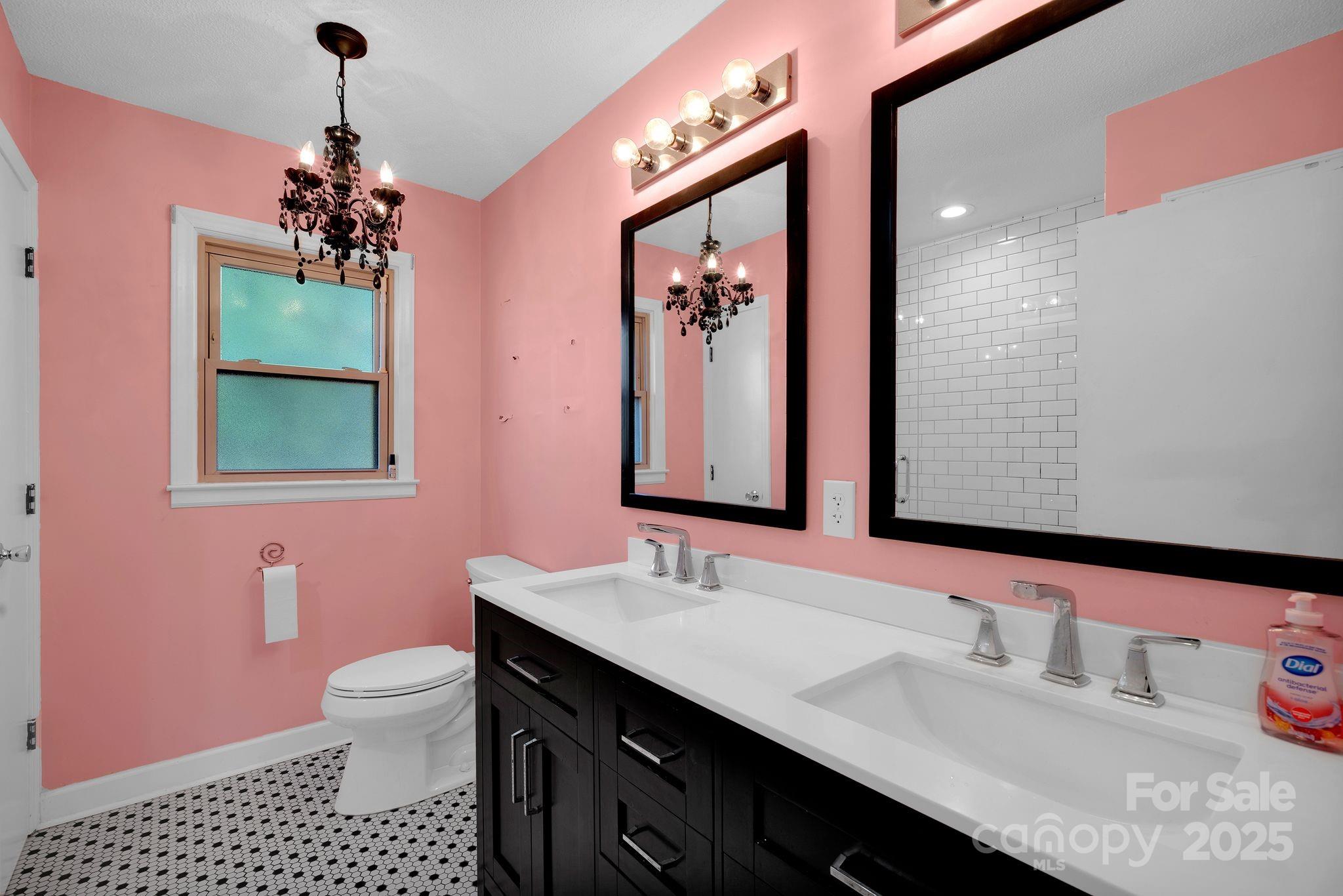 3168 Sossamon Place Concord, NC 28025 - Photo 11 of 37 a bathroom with a sink vanity and a mirror