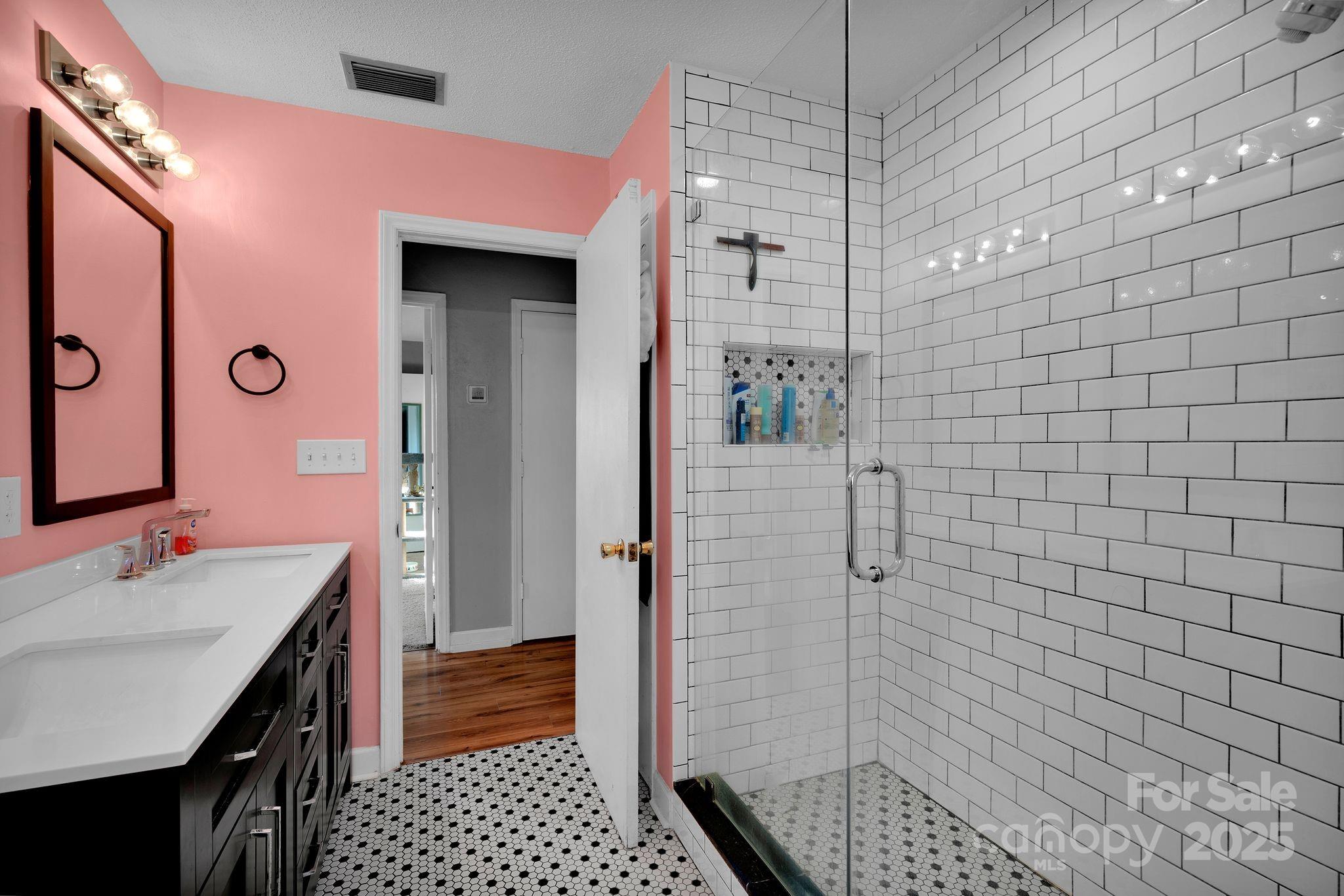3168 Sossamon Place Concord, NC 28025 - Photo 12 of 37 a bathroom with a sink shower and a mirror