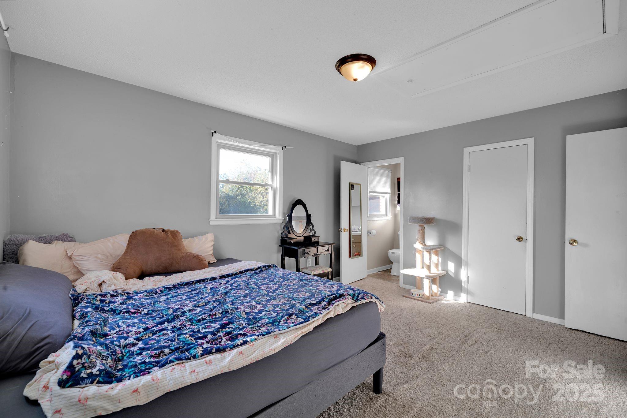 3168 Sossamon Place Concord, NC 28025 - Photo 13 of 37 a bed room with a bed and a window