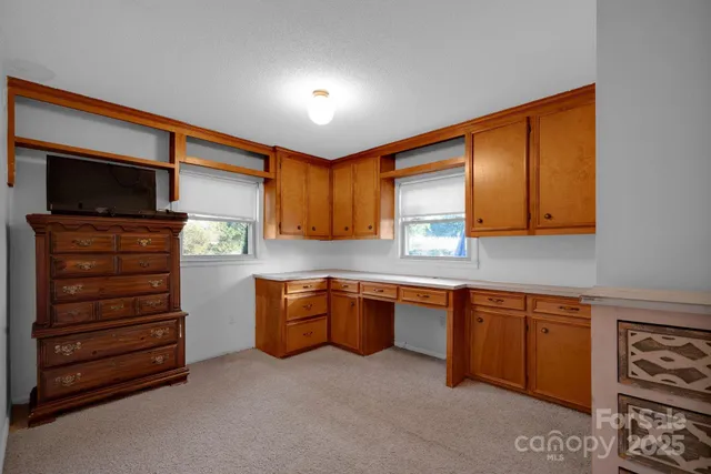 a kitchen with stainless steel appliances granite countertop a sink and cabinets