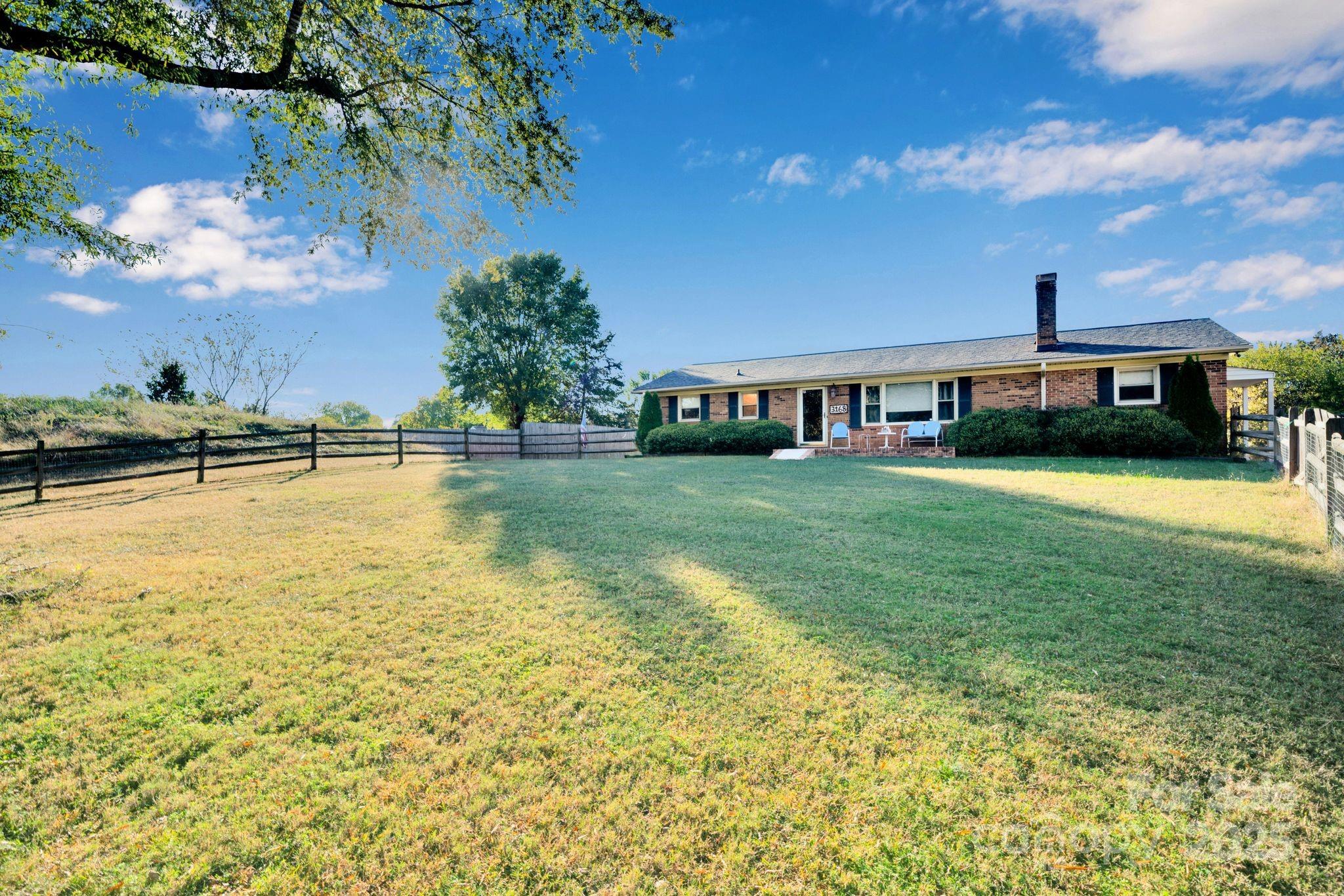 3168 Sossamon Place Concord, NC 28025 - Photo 2 of 37 a view of a swimming pool in front of the house