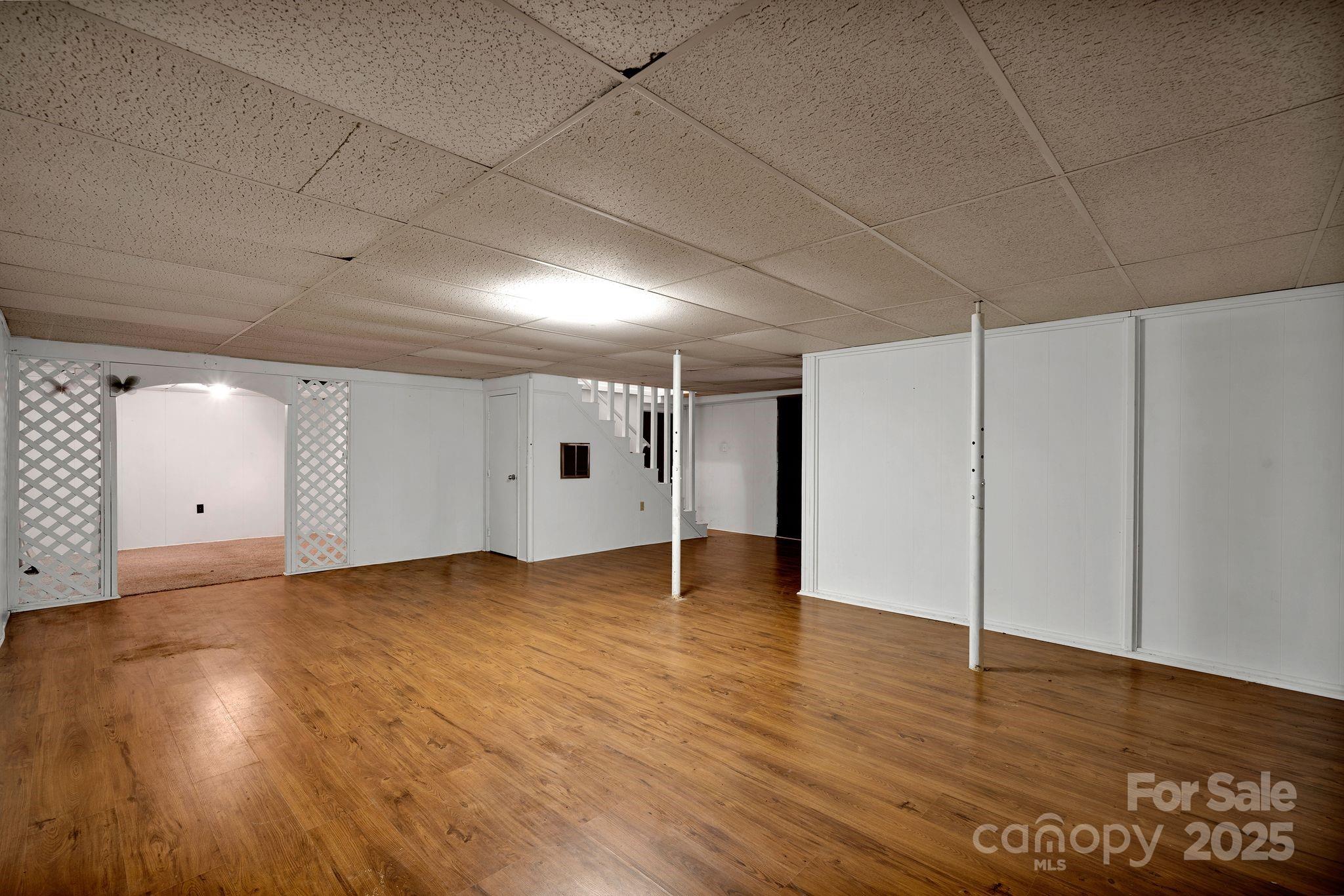 3168 Sossamon Place Concord, NC 28025 - Photo 26 of 37 a view of an empty room with wooden floor