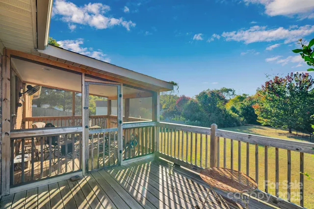 a view of a balcony with wooden floor