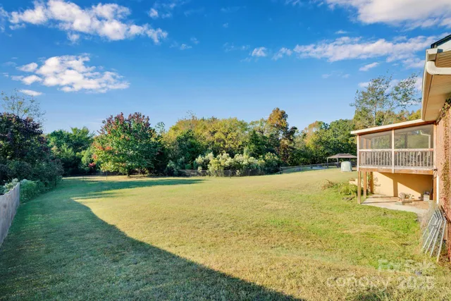 a view of swimming pool with a yard