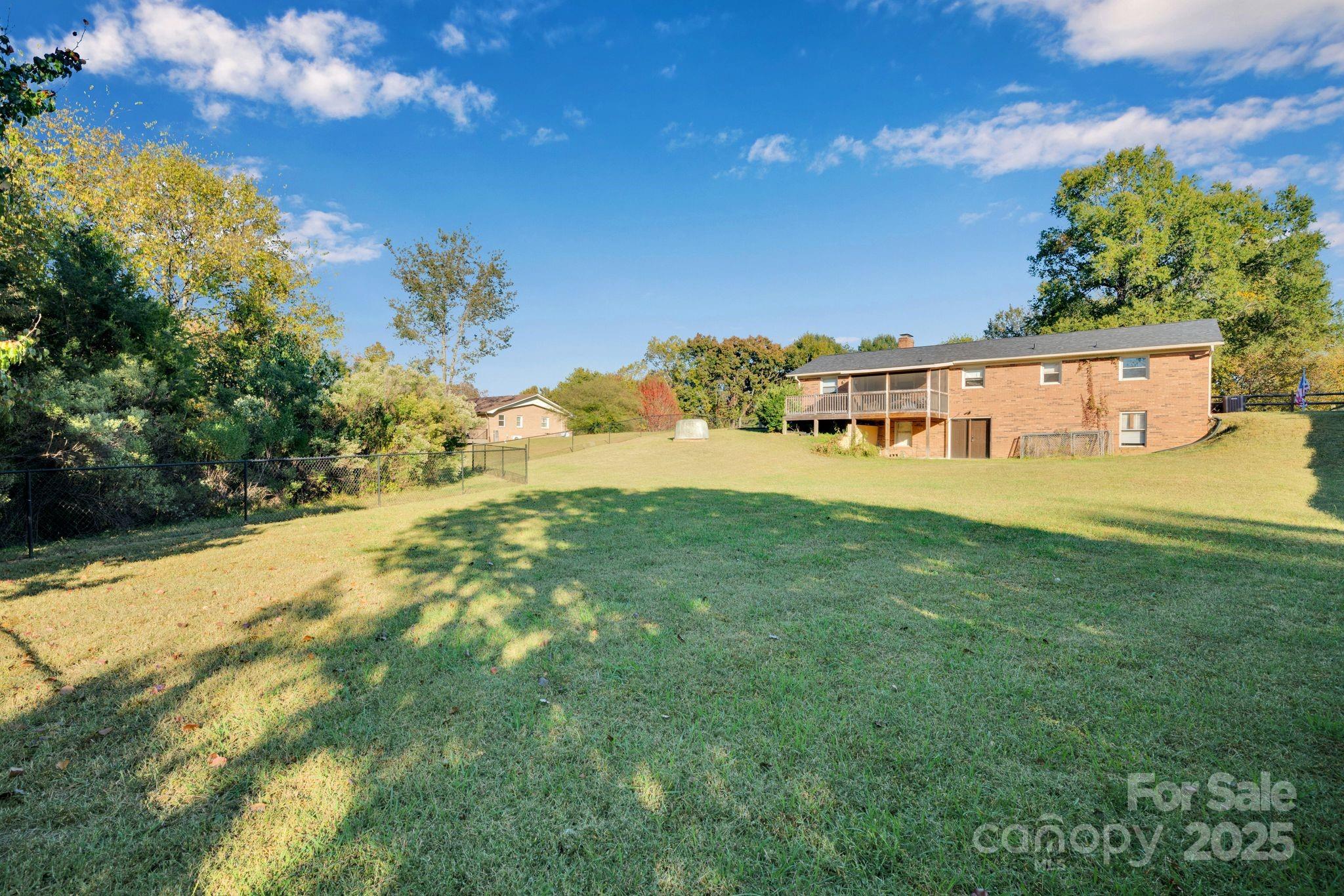 3168 Sossamon Place Concord, NC 28025 - Photo 37 of 37 a view of a big yard with large trees