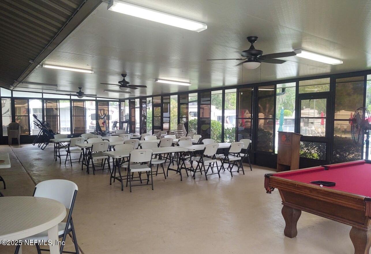 1074 Front Street, Unit 50B Welaka, FL 32193 - Photo 19 of 20 a dining room with lots of furniture and view of kitchen