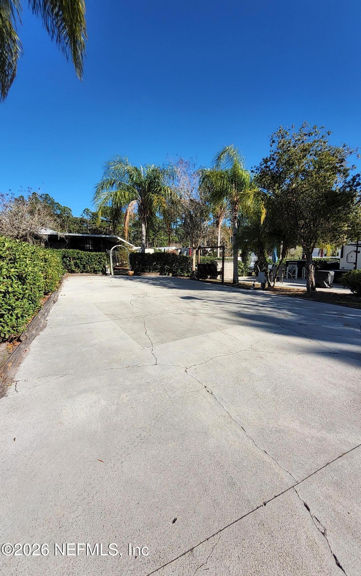 1074 Front Street, Unit 50B Welaka, FL 32193 - Photo 3 of 20 a view of a roadside with trees