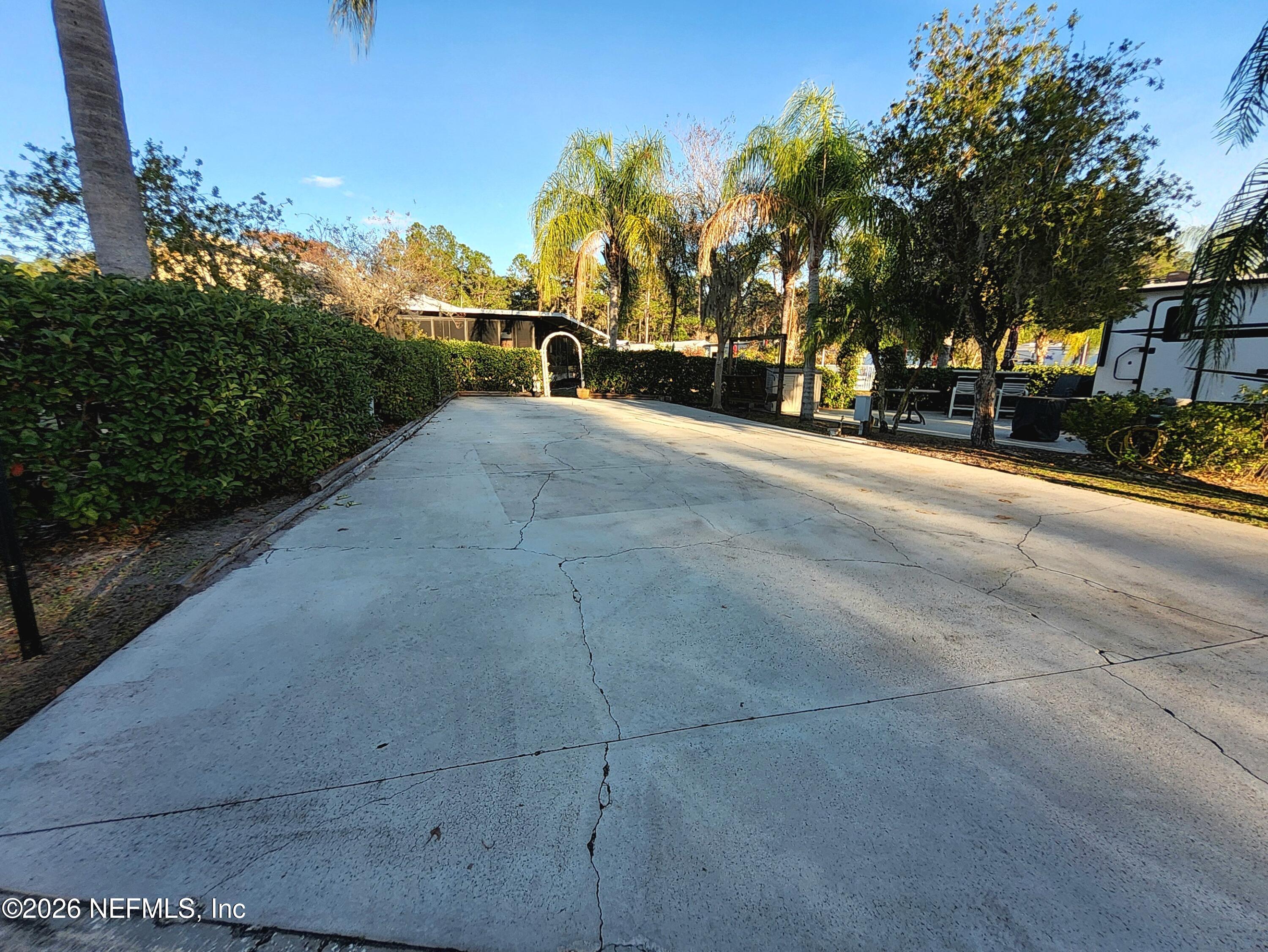 1074 Front Street, Unit 50B Welaka, FL 32193 - Photo 4 of 20 a view of road with trees