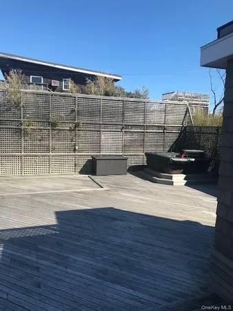 a view of a swimming pool with a lounge chair