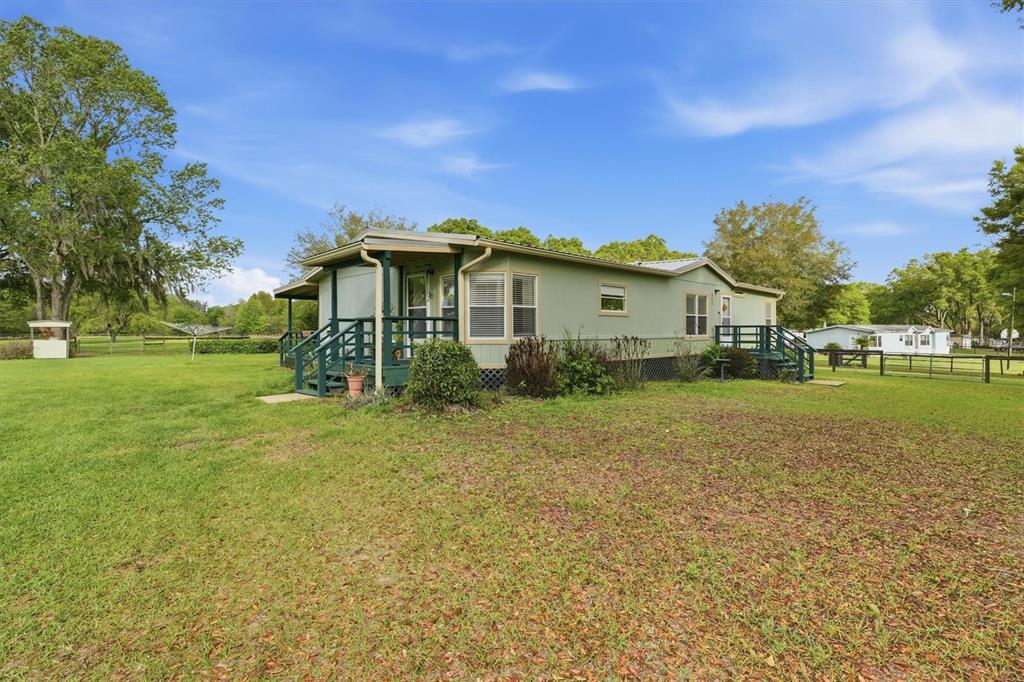a view of a house with a big yard