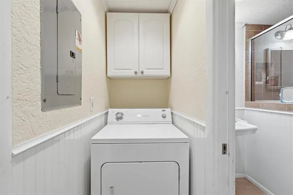 a utility room with dryer and washer