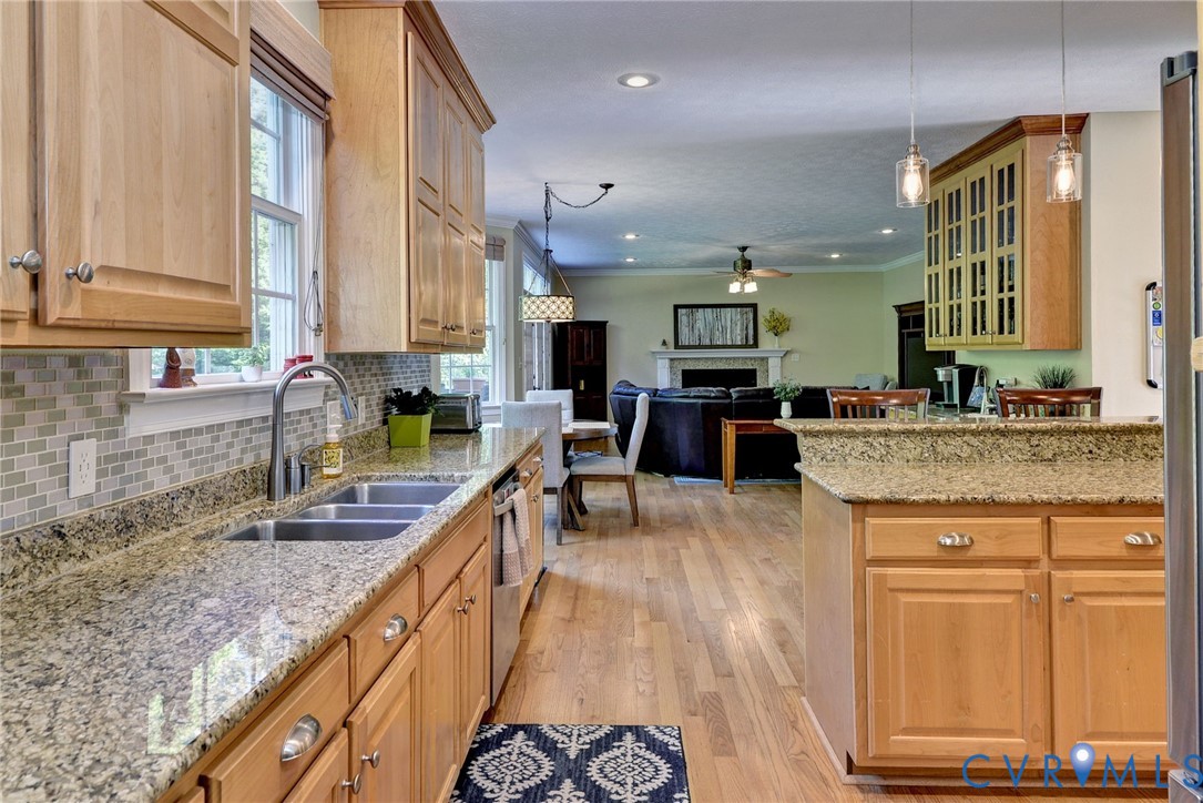 4015 Cold Spring Road Williamsburg, VA 23188 - Photo 21 of 57 Kitchen featuring light wood cabinetry, granite co