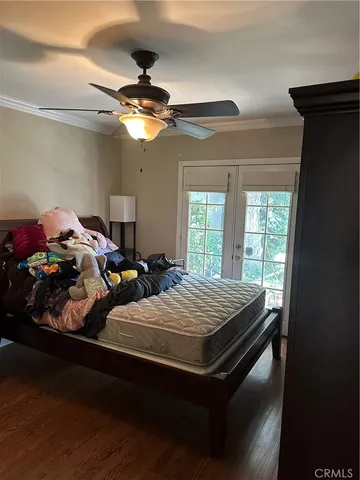 a bedroom with bed and window