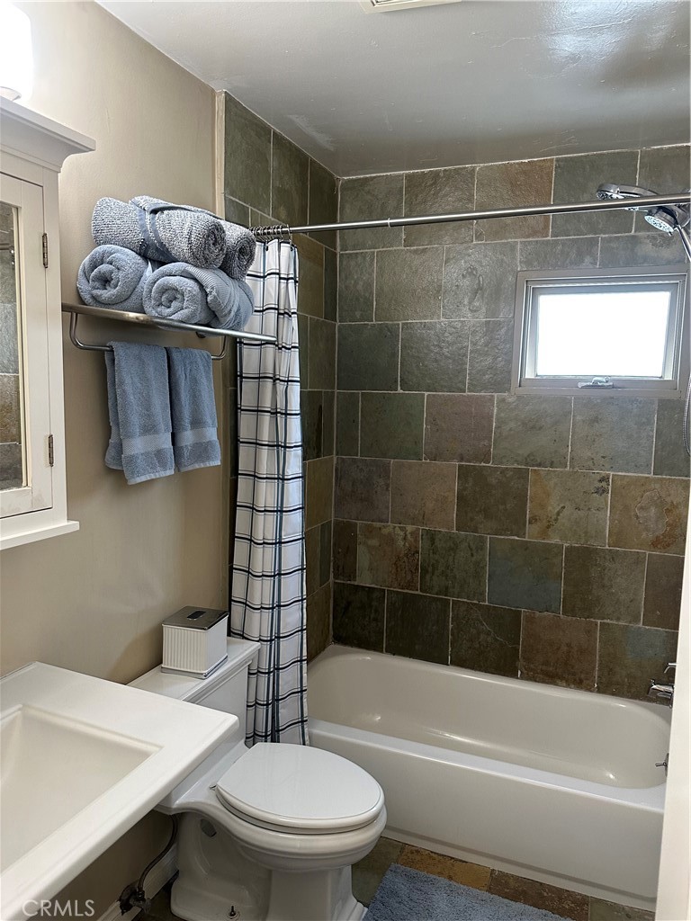 4910 Willowcrest Avenue Toluca Lake, CA 91601 - Photo 15 of 25 a bathroom with a sink toilet and shower