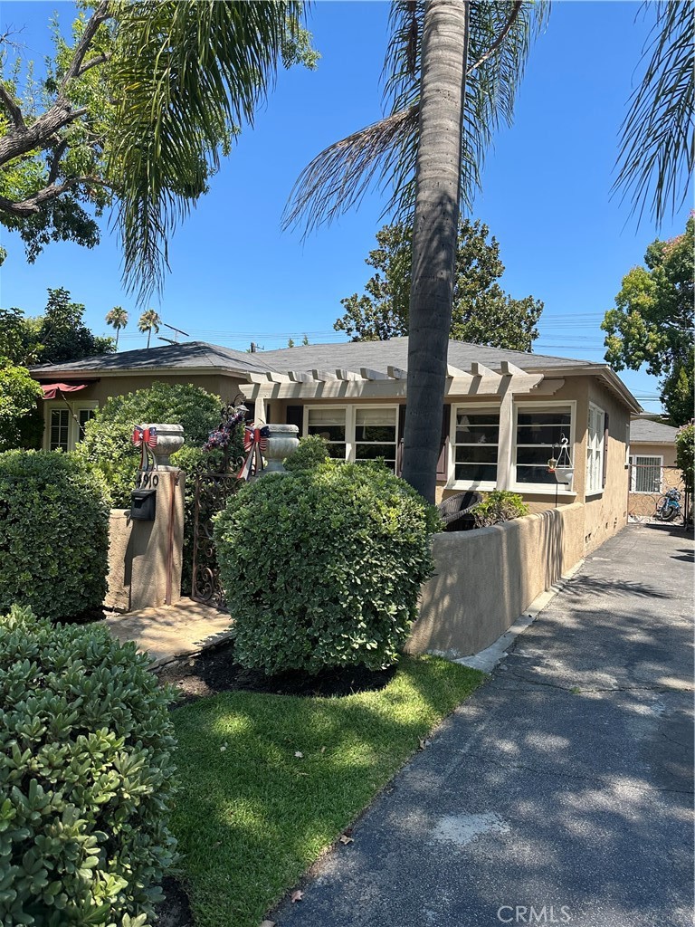 4910 Willowcrest Avenue Toluca Lake, CA 91601 - Photo 2 of 25 a front view of a house with a garden