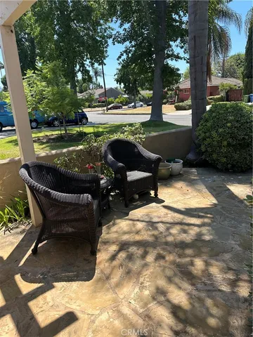 a view of a backyard with sitting area