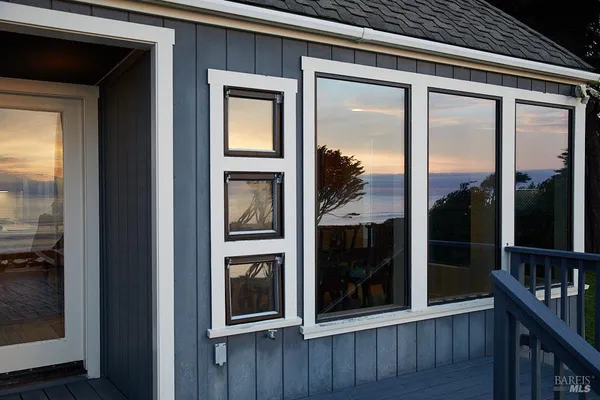 a view of a door and a window
