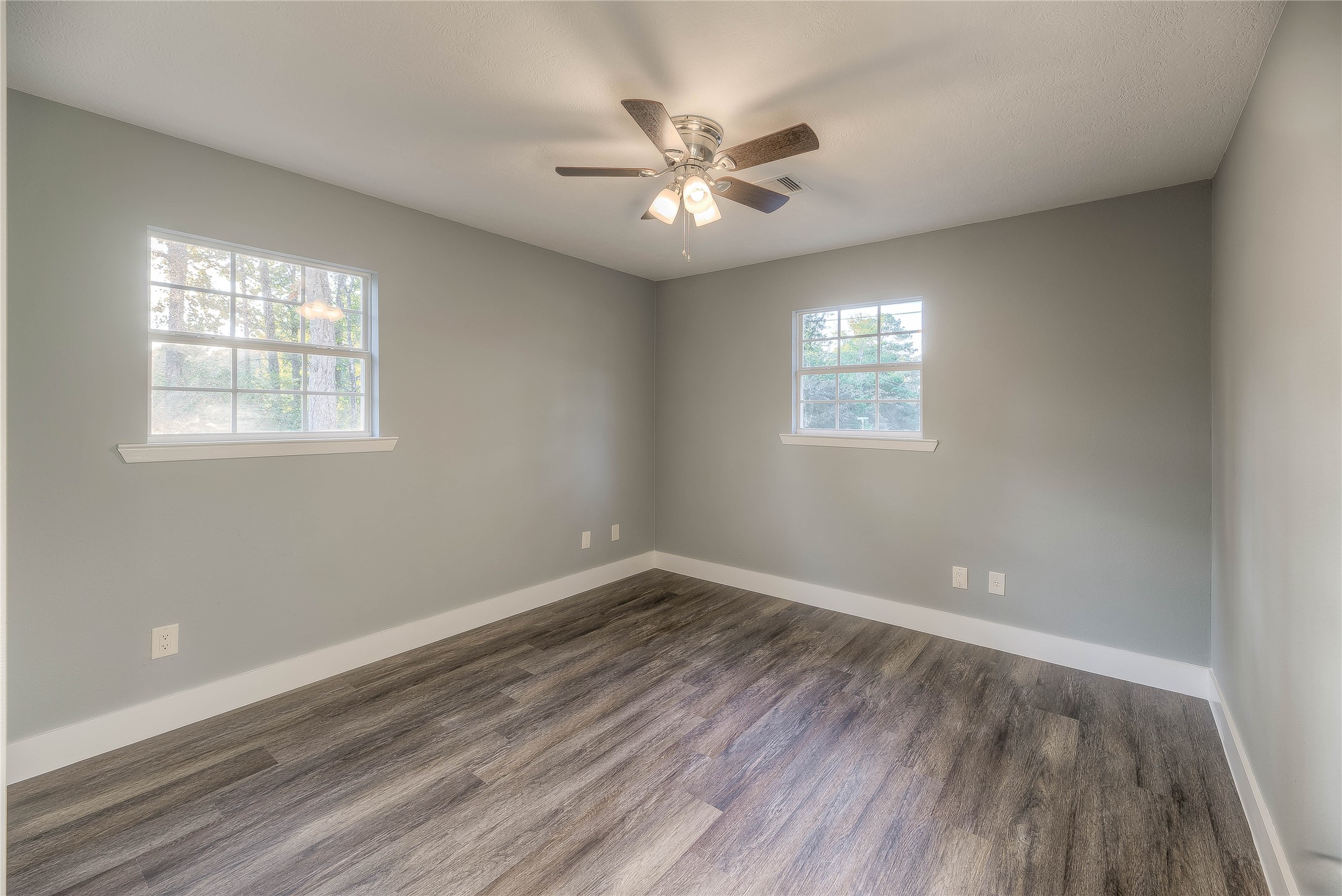 388 Sunrise Wood Road Goodrich, TX 77335 - Photo 13 of 33 wooden floor in an empty room with a window