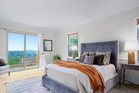 a view of a city and mountain from a balcony