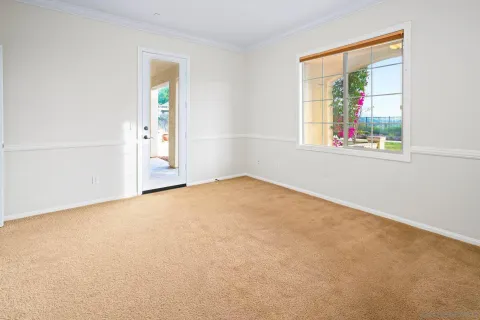 a bathroom with a sink a toilet a mirror and shower