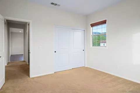a view of a livingroom with kitchen