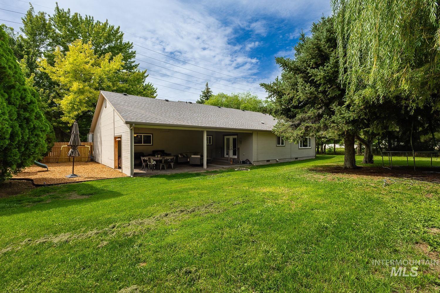 7166 South Cloverdale Road Boise, ID 83709 - Photo 23 of 50 Covered patio with a high ceiling and a ceiling fan