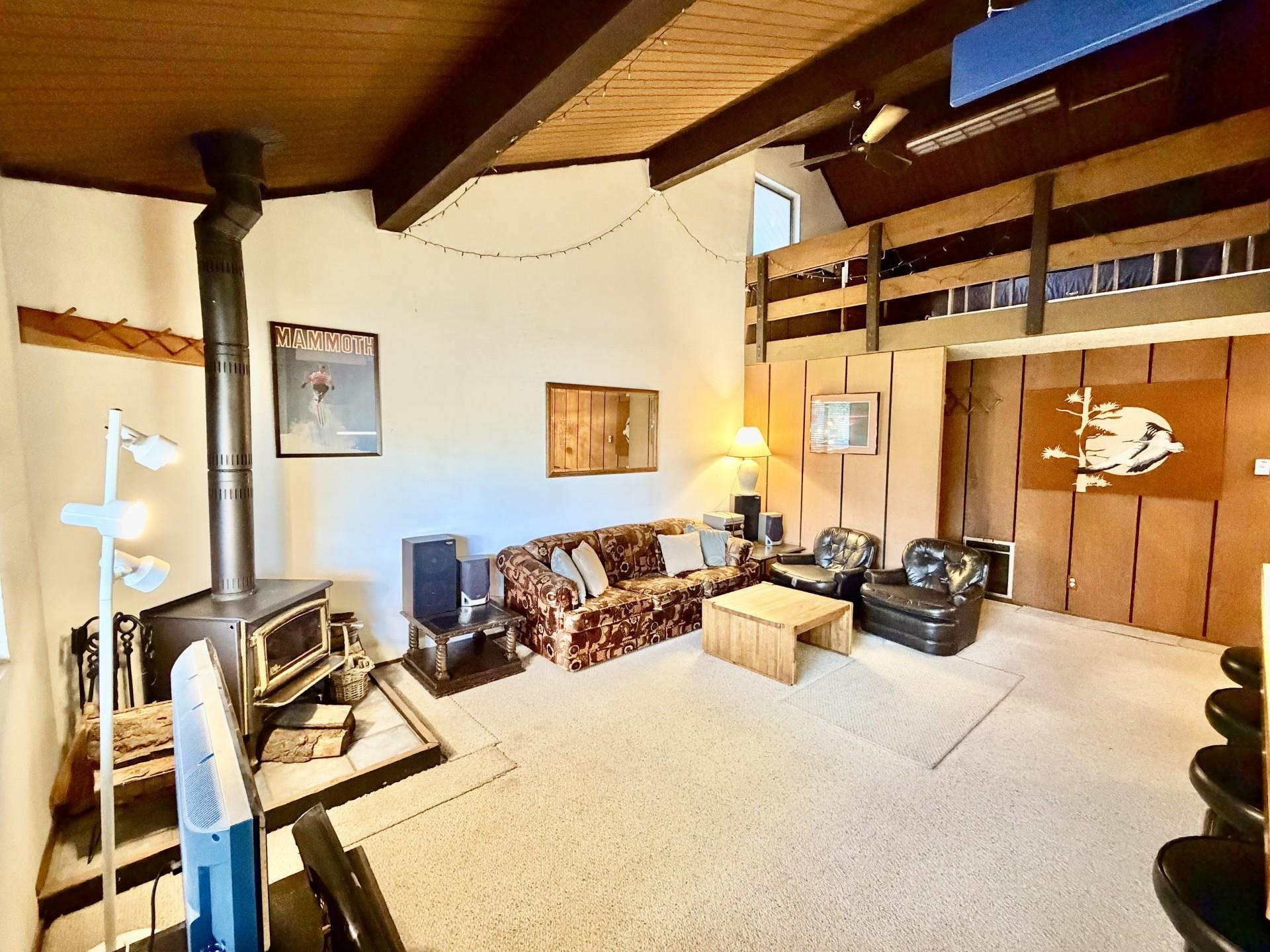 165 Old Mammoth Road, Unit 105 Mammoth Lakes, CA 93546 - Photo 3 of 17 a view of a livingroom with furniture and windows