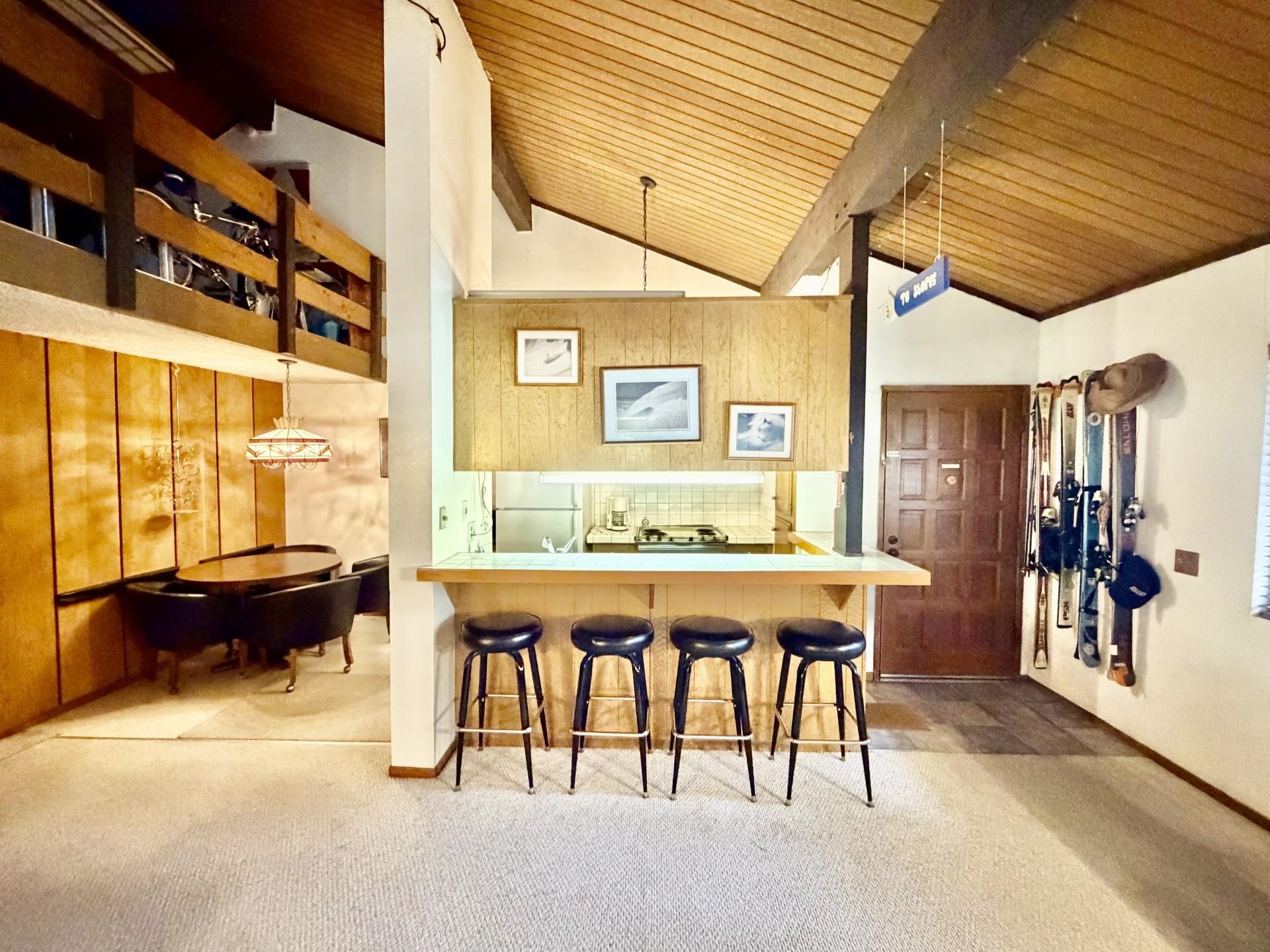 165 Old Mammoth Road, Unit 105 Mammoth Lakes, CA 93546 - Photo 4 of 17 a dining room with a table and chairs