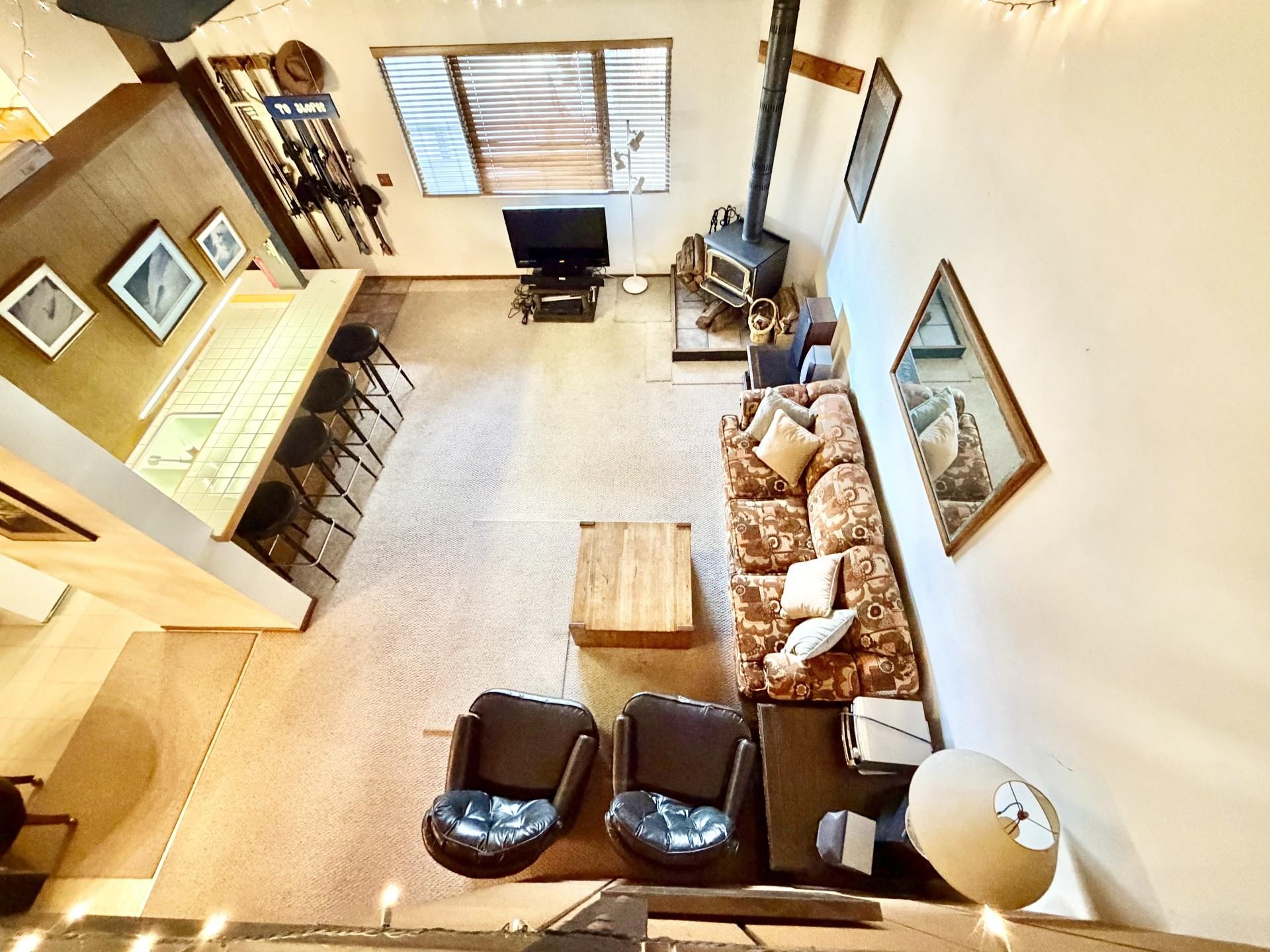 165 Old Mammoth Road, Unit 105 Mammoth Lakes, CA 93546 - Photo 5 of 17 a living room with furniture and a flat screen tv